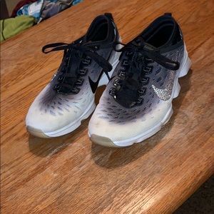 Custom made bling Nike tennis shoes.